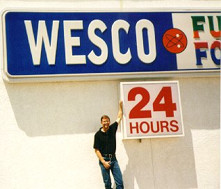 Wes under a Wesco sign