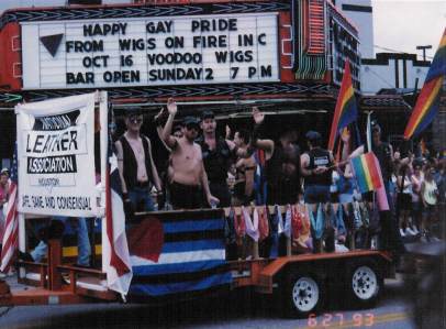 Dean on the NLA:Houston float in the 1993 Houston Gay Pride parade.  He's the third person from the left, under the marquee number 2.